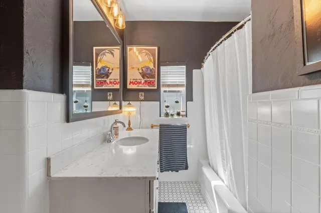 a bathroom with a sink and a mirror