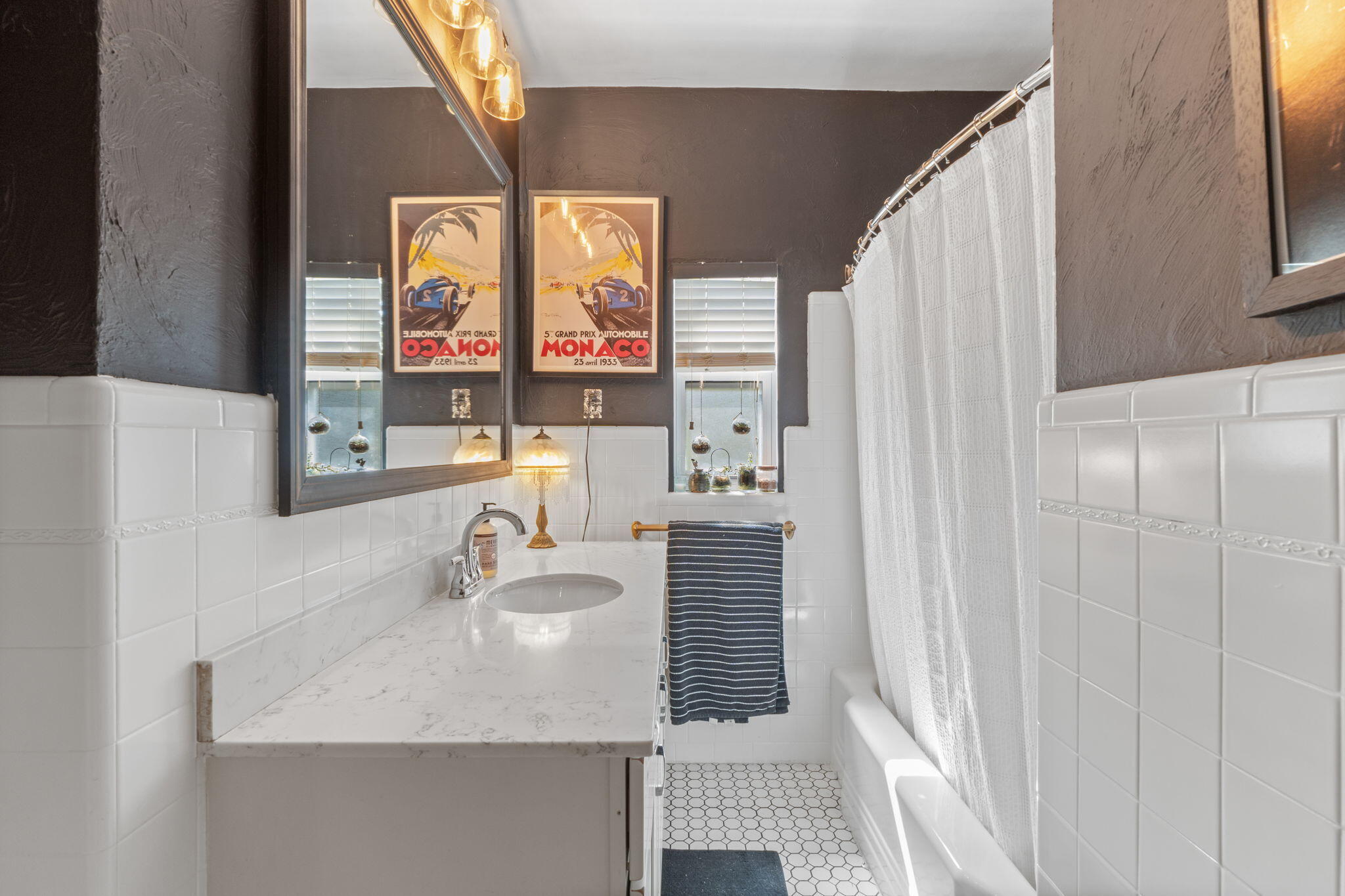 2016 East Scott Street Pensacola, FL 32503 - Photo 19 of 26 a bathroom with a sink and a mirror