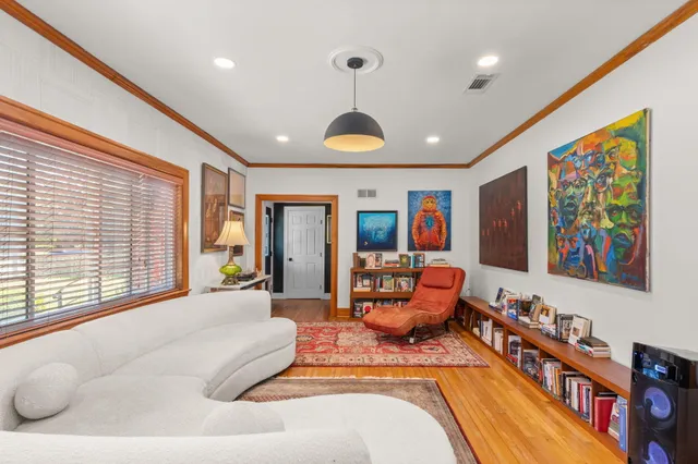 a spacious bedroom with a large bed and a large window