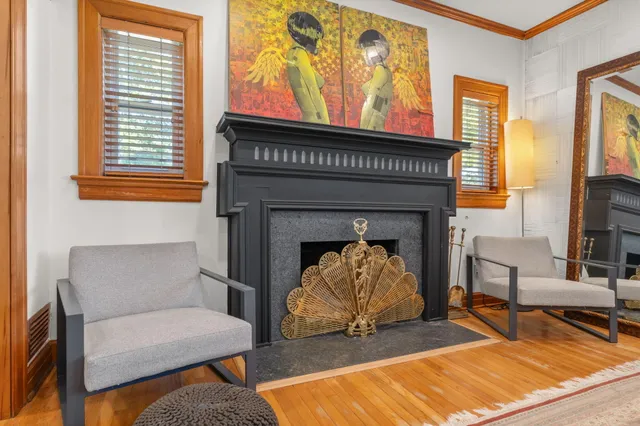 a living room with furniture and a fireplace
