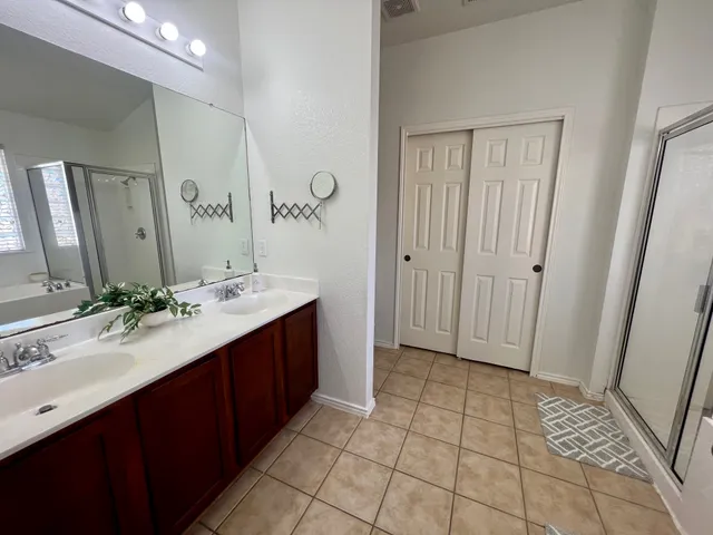 a bathroom with a bathtub and a shower