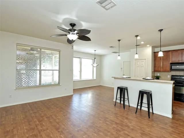 a bathroom with a sink a vanity and a large mirror