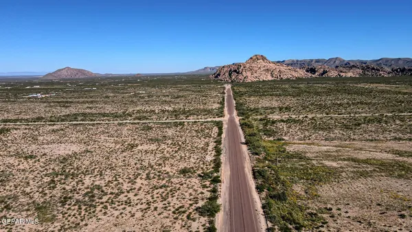 a view of a yard with a mountain