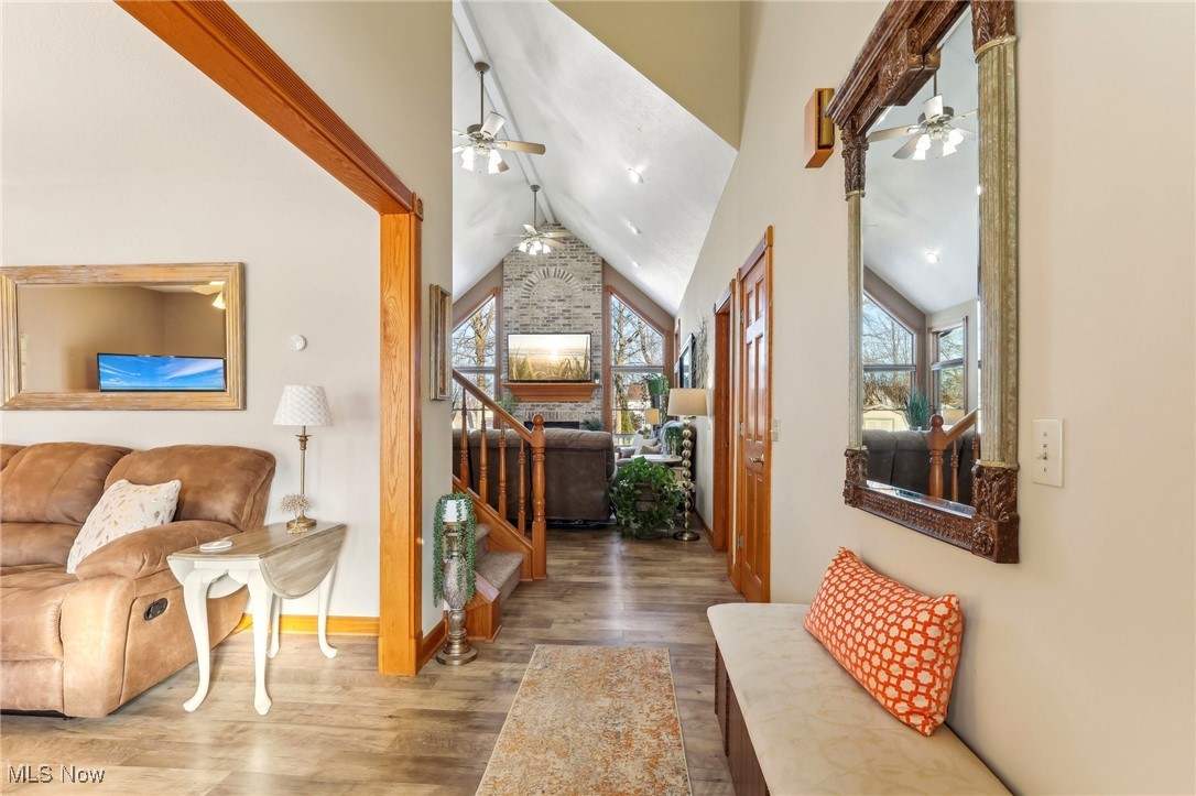 3353 Jens Way Perry, OH 44081 - Photo 7 of 49 Hallway featuring hardwood / wood-style flooring and vaulted ceiling