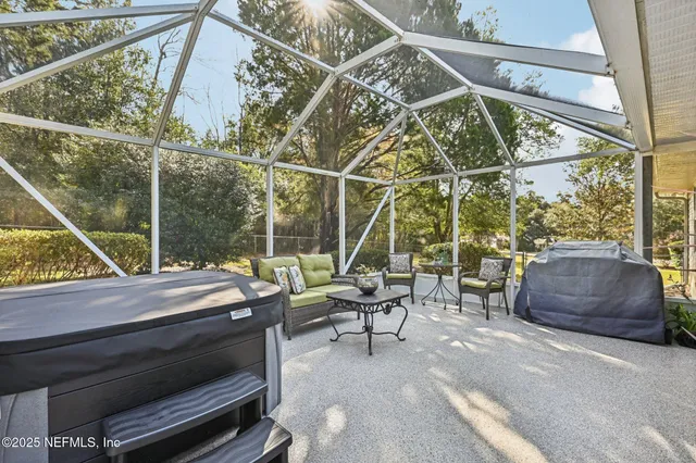 an aerial view of residential houses with outdoor space and lake view