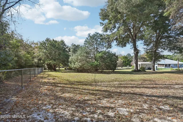 a view of a swimming pool with a yard