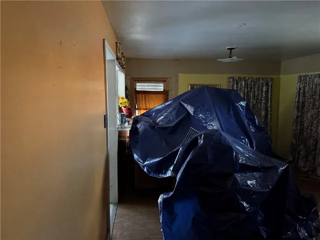 a bedroom with furniture and a lamp