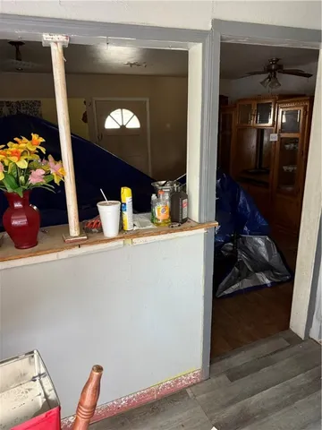a view of living room with furniture and a fireplace