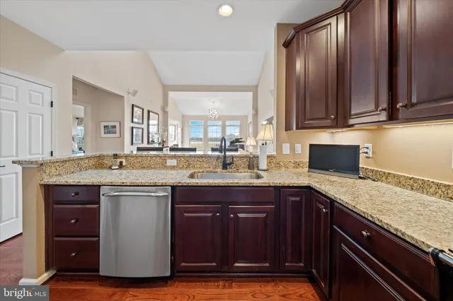 a spacious bedroom with a bed and a flat screen tv
