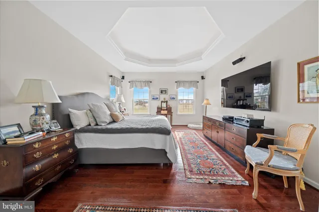 a spacious bathroom with a bathtub sink and mirror