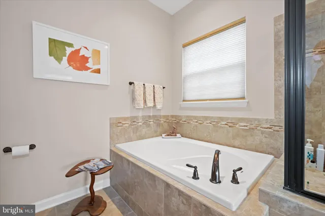 a bedroom with a bed and a lamp on table