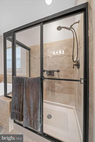 a living room with furniture and book shelf