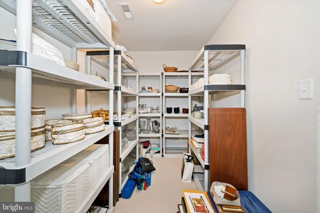 a bathroom with a double vanity sink toilet and shower
