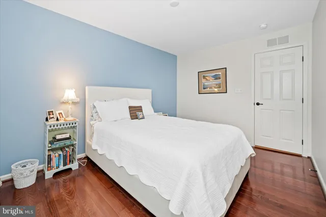 a view of a living room with furniture and a large window