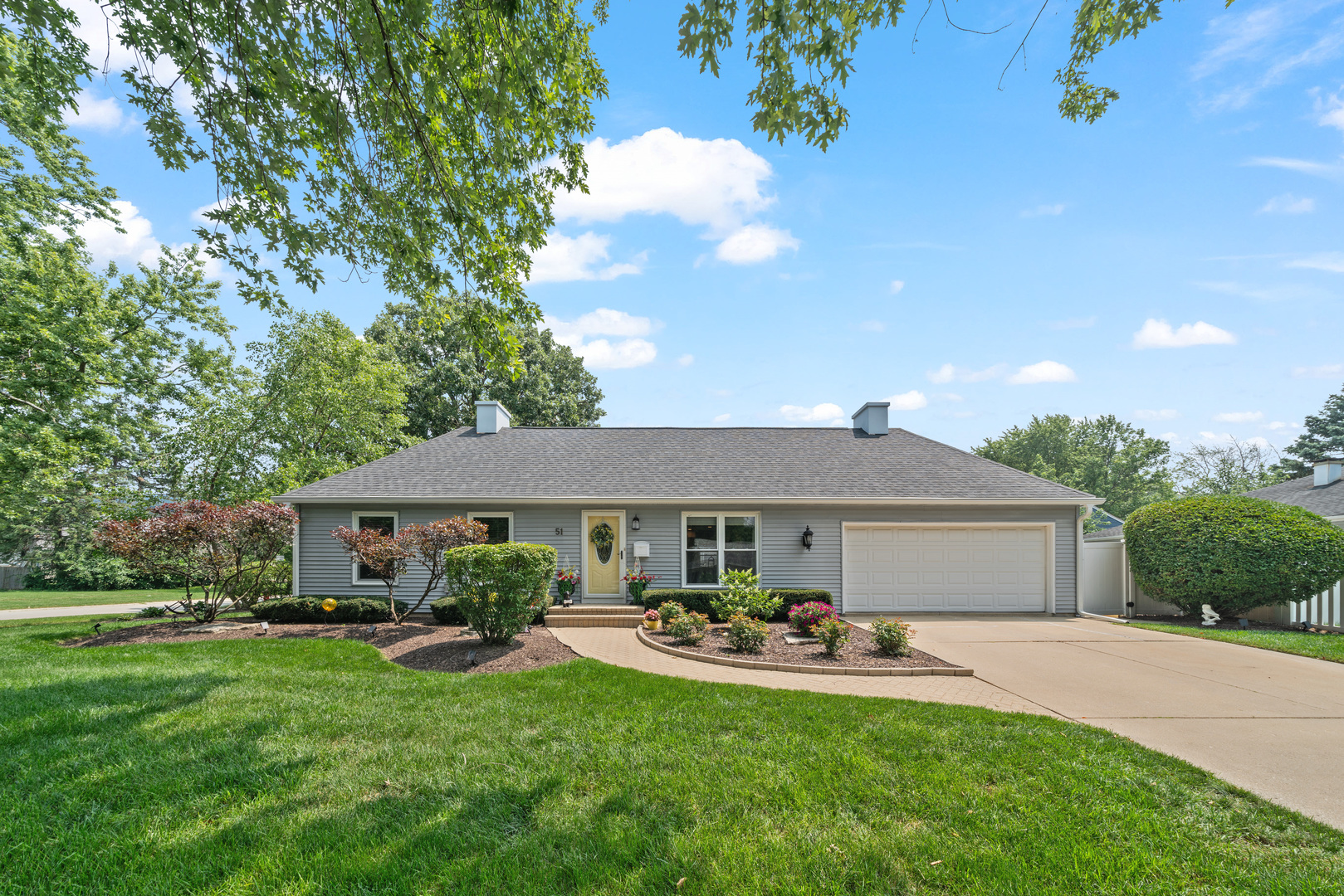 51 Winrock Road Montgomery, IL 60538 - Photo 1 of 26 a front view of a house with yard porch and sitting area