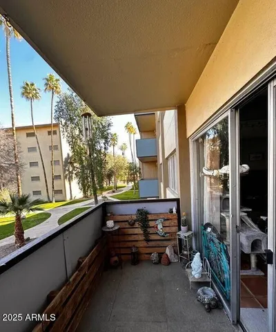 a swimming pool with outdoor seating and yard