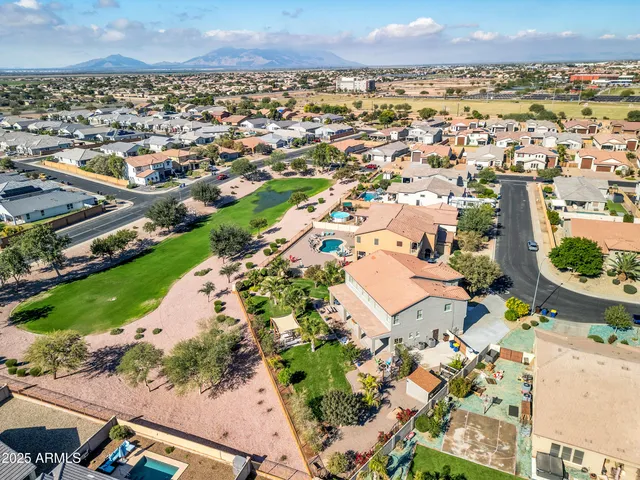 an aerial view of residential houses with outdoor space