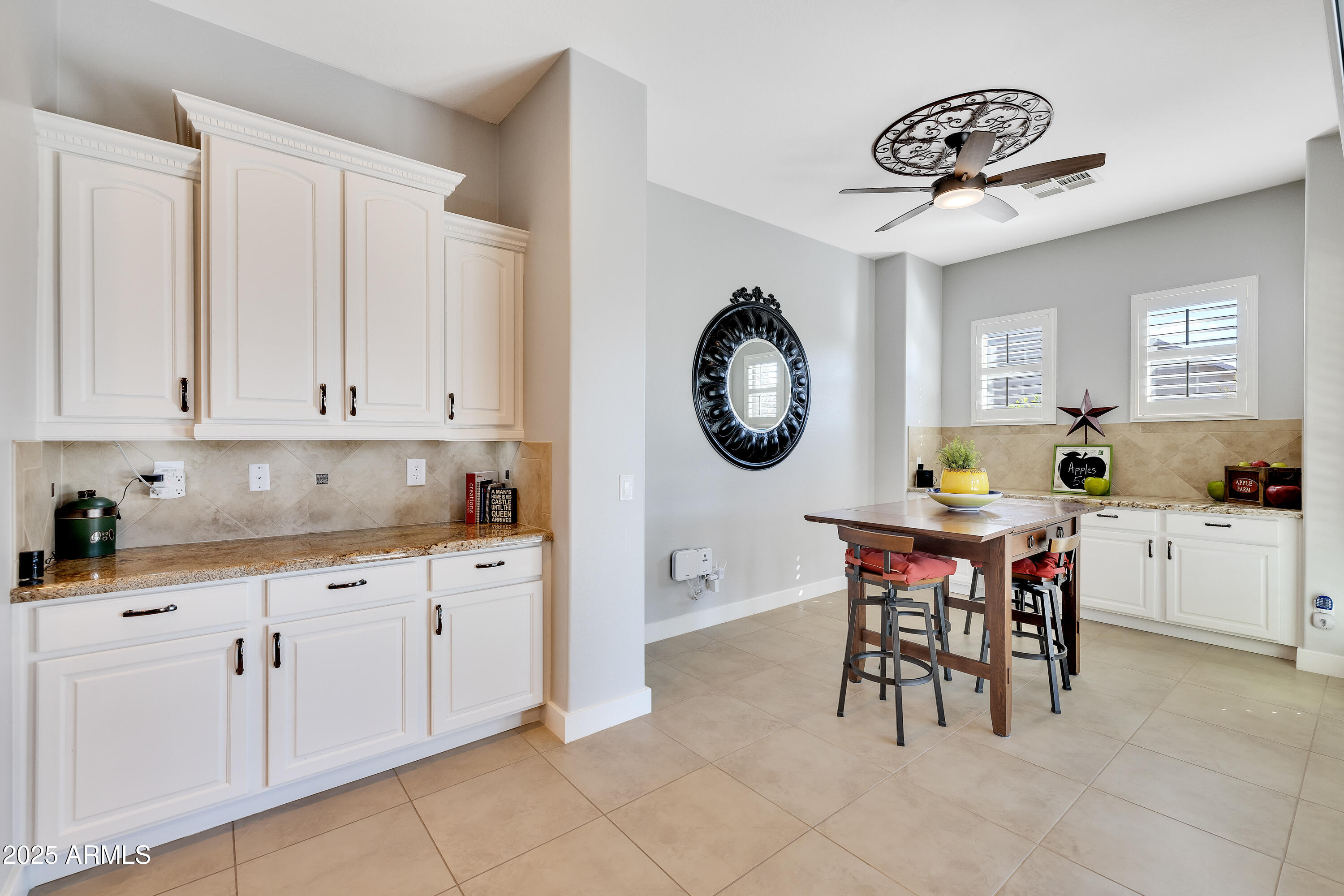 16896 North Palo Rojo Road Maricopa, AZ 85138 - Photo 15 of 48 a kitchen with a sink and cabinets