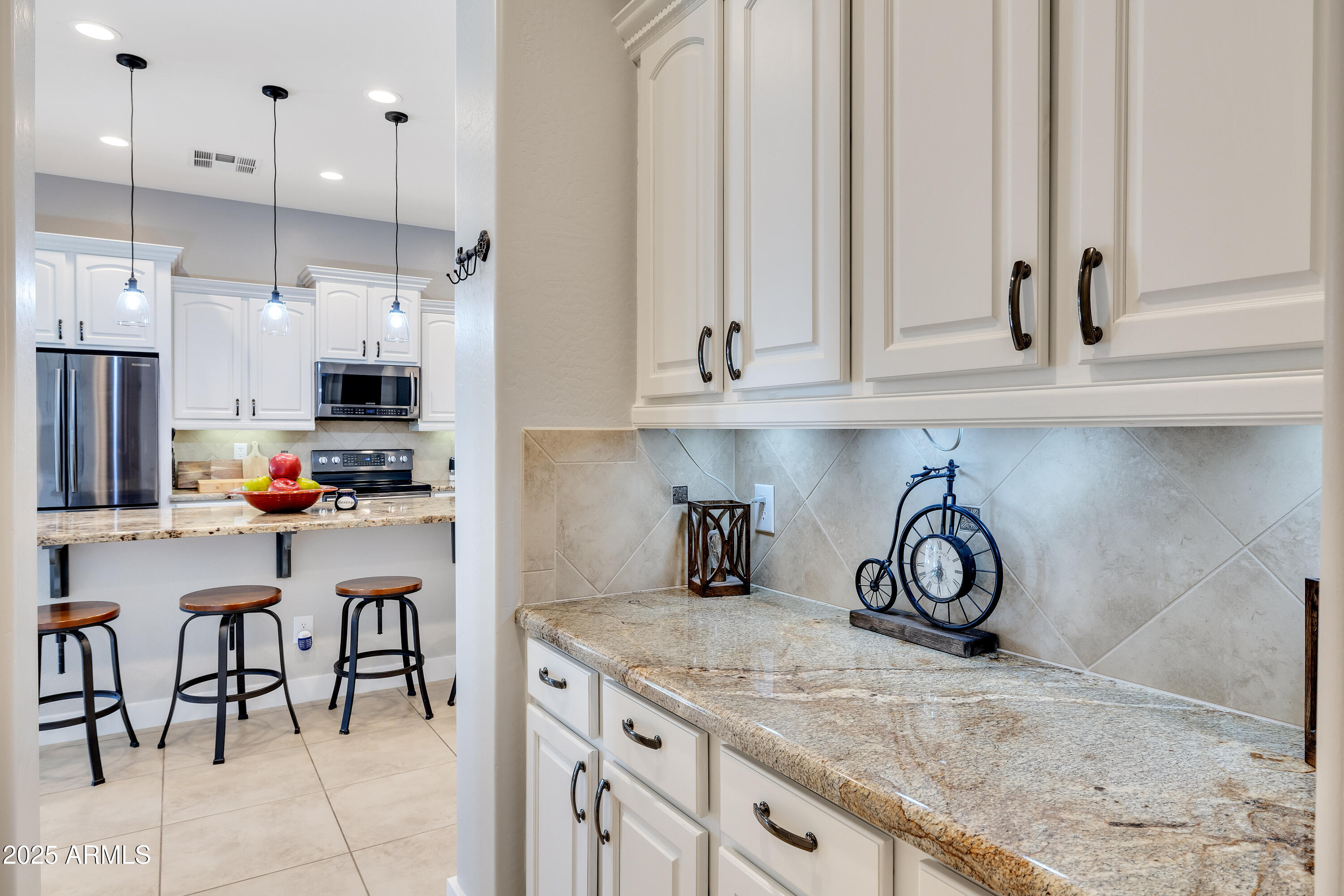 16896 North Palo Rojo Road Maricopa, AZ 85138 - Photo 16 of 48 a kitchen with stainless steel appliances granite countertop a sink and a refrigerator