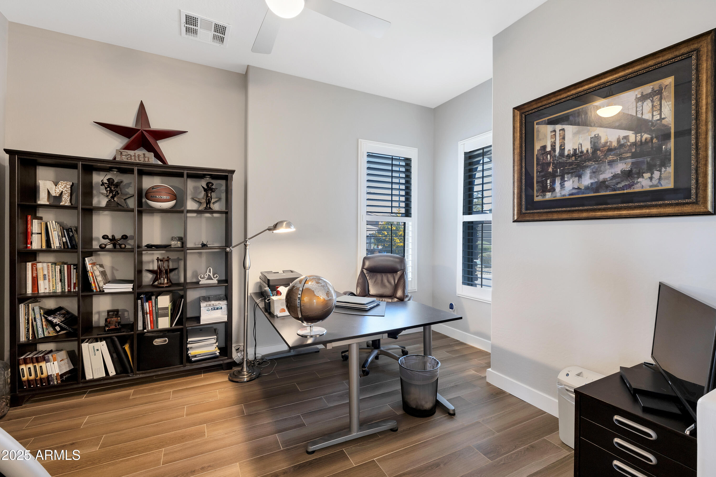 16896 North Palo Rojo Road Maricopa, AZ 85138 - Photo 17 of 48 a view of a workspace with furniture and wooden floor
