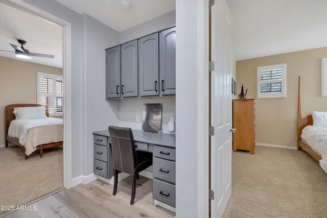 a view of bedroom with furniture and a window