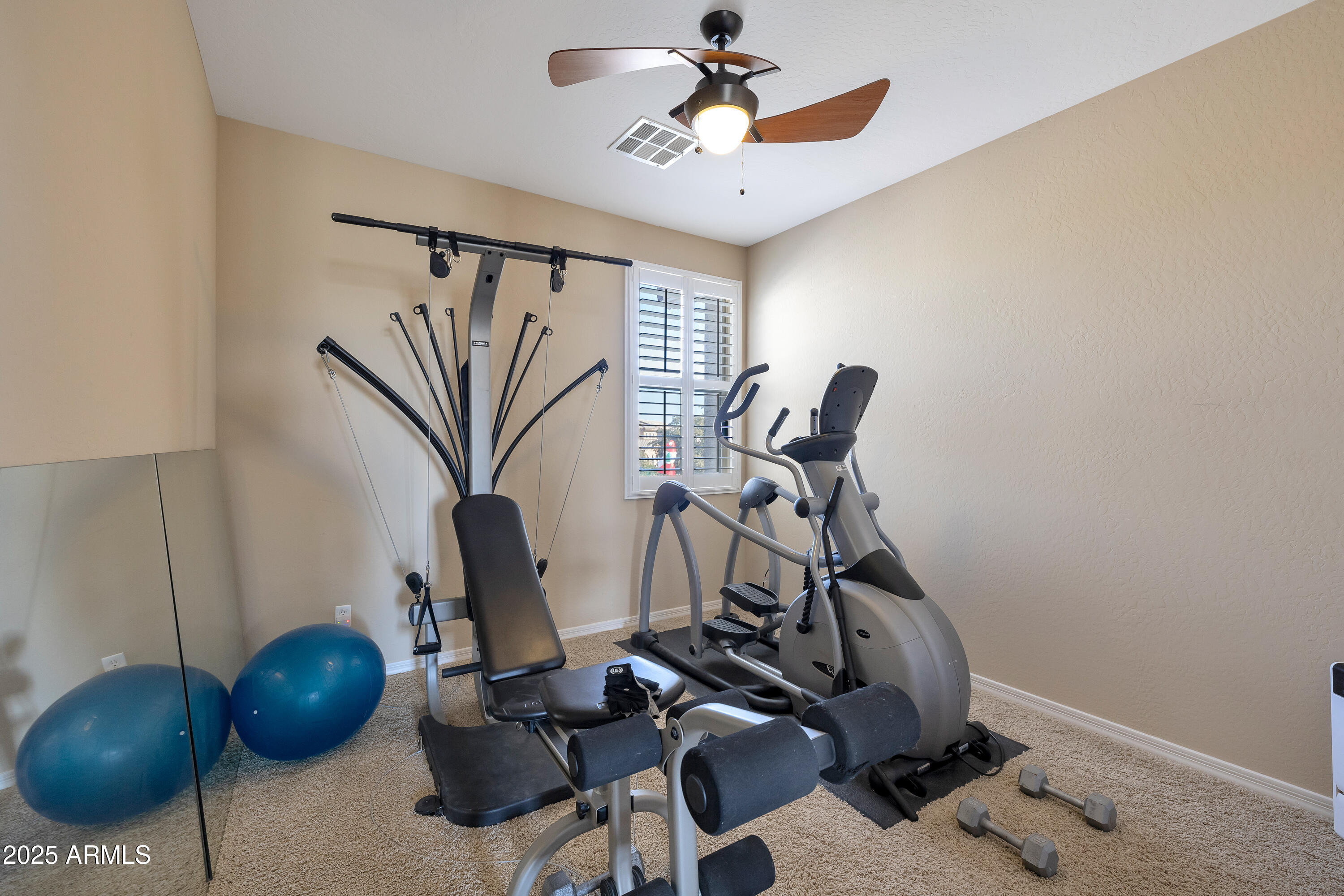 16896 North Palo Rojo Road Maricopa, AZ 85138 - Photo 29 of 48 a view of a room with gym equipment