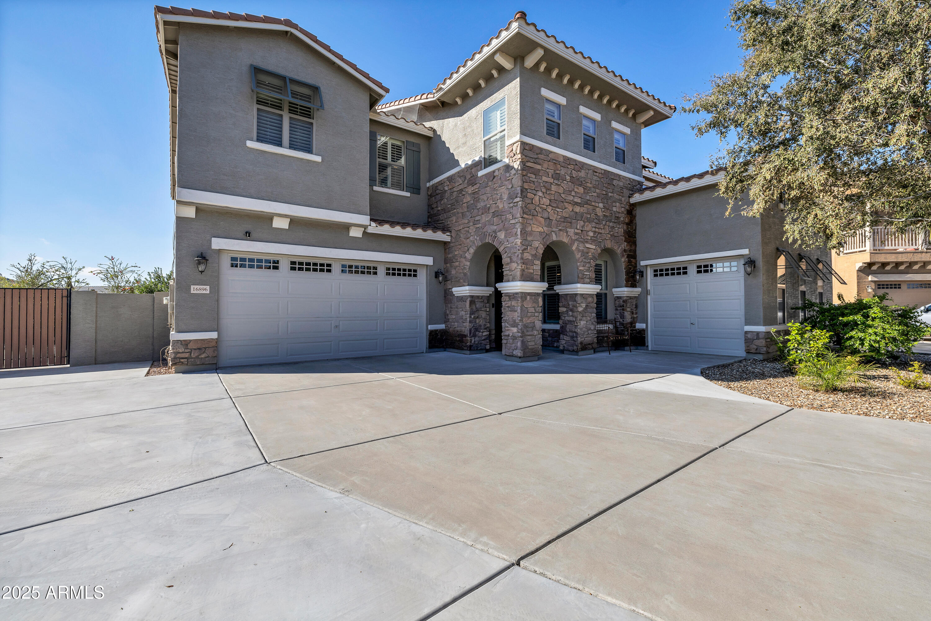 16896 North Palo Rojo Road Maricopa, AZ 85138 - Photo 2 of 48 front view of a house with a street