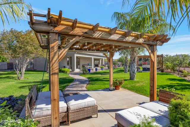 a view of a park with furniture and garden