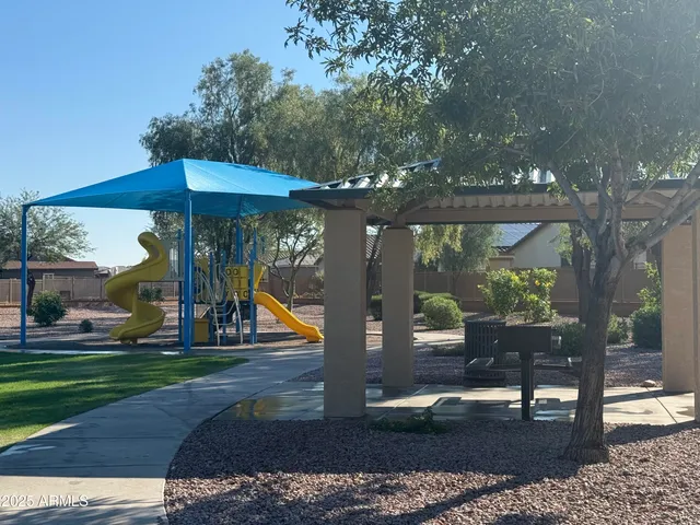 a view of house with a yard