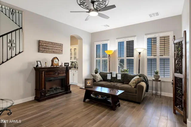 a living room with furniture and a fireplace