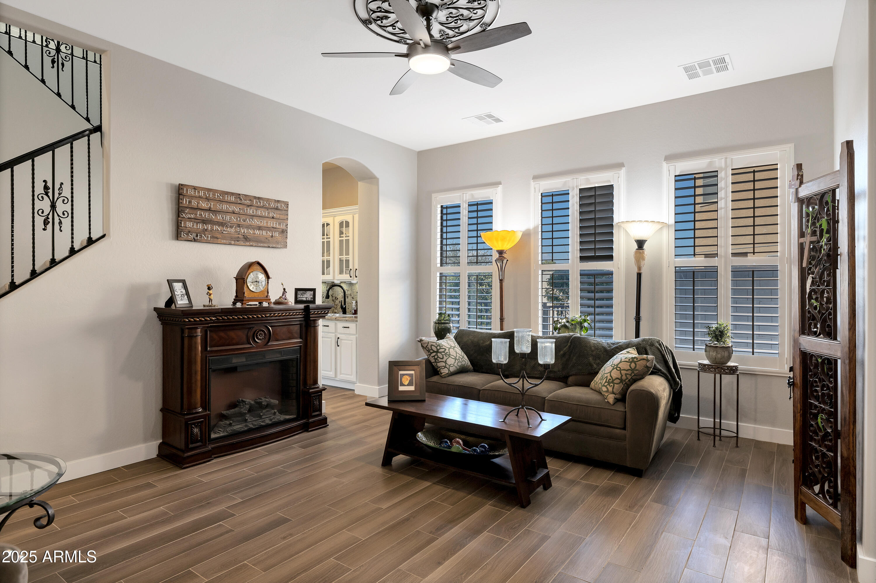 16896 North Palo Rojo Road Maricopa, AZ 85138 - Photo 6 of 48 a living room with furniture and a fireplace