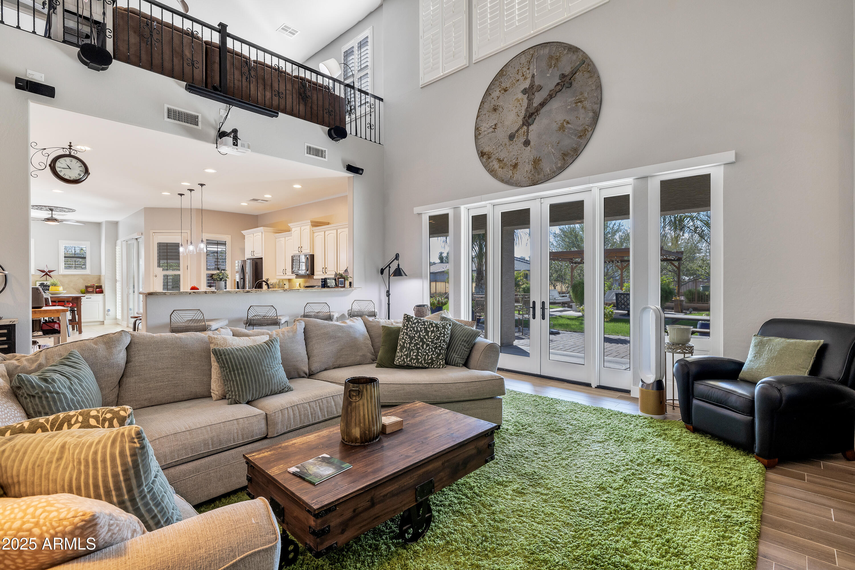 16896 North Palo Rojo Road Maricopa, AZ 85138 - Photo 8 of 48 a living room with furniture a rug and a large window