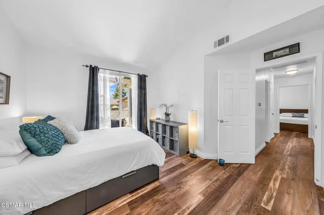 a bed room with a bed and a lamp