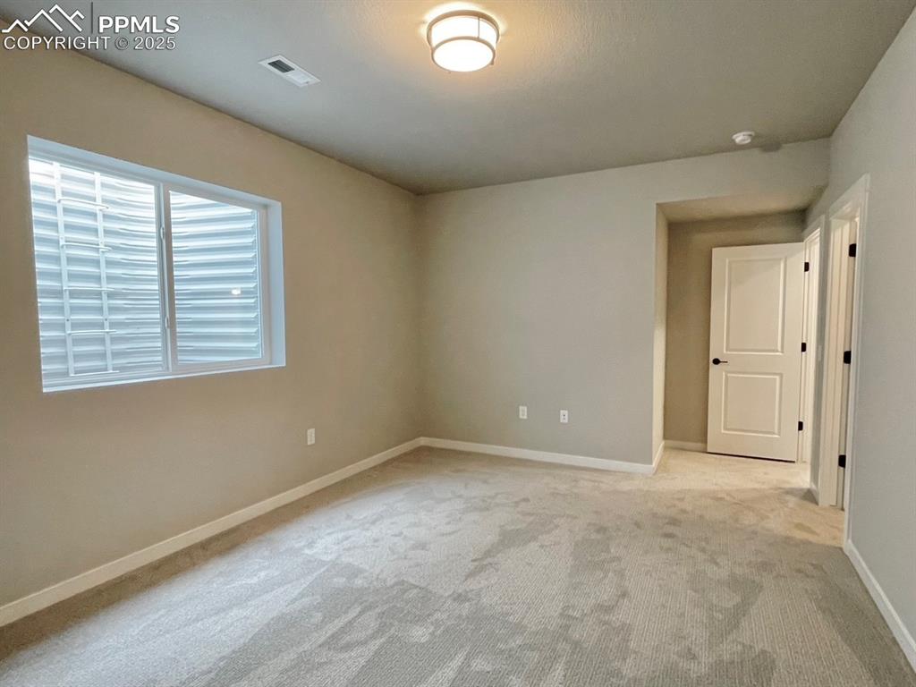 6593 Vistancia Avenue Colorado Springs, CO 80922 - Photo 15 of 21 a view of an empty room with a window