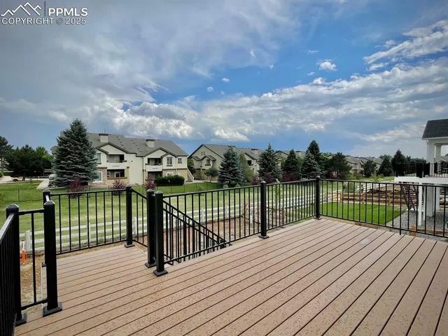 a view of a balcony with wooden floor