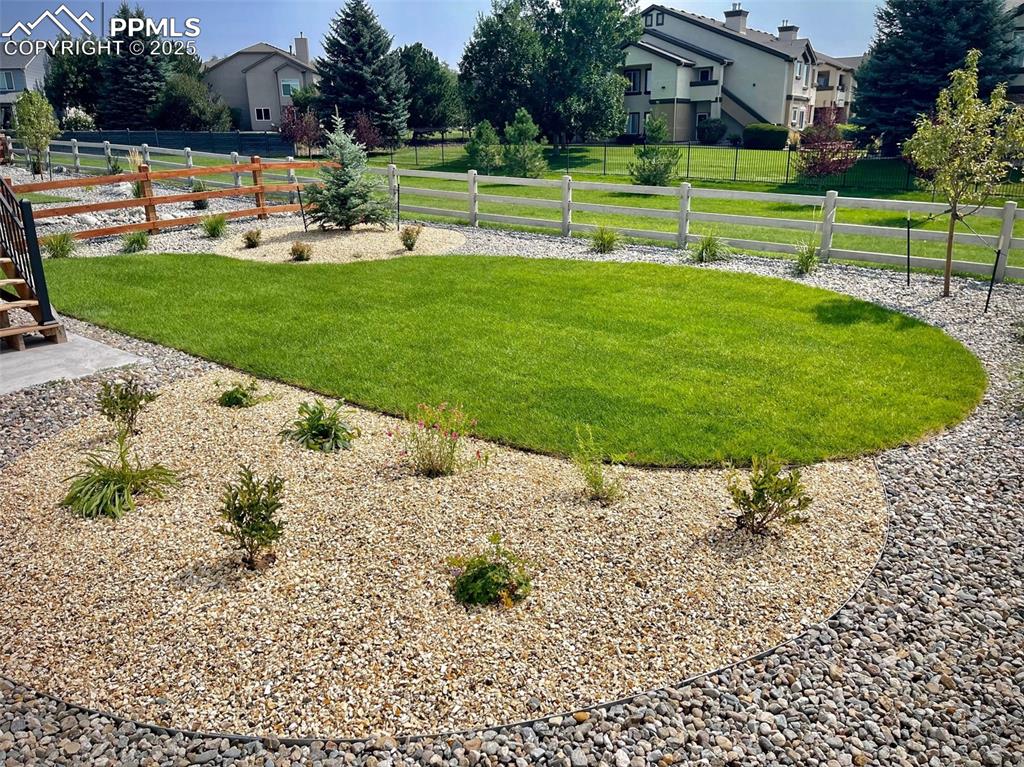 6593 Vistancia Avenue Colorado Springs, CO 80922 - Photo 19 of 21 a view of a park with large trees