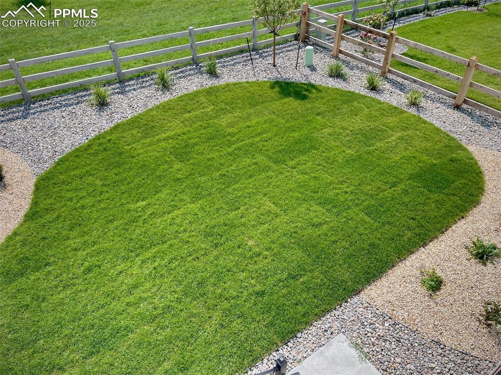 6593 Vistancia Avenue Colorado Springs, CO 80922 - Photo 21 of 21 a view of a backyard with a park