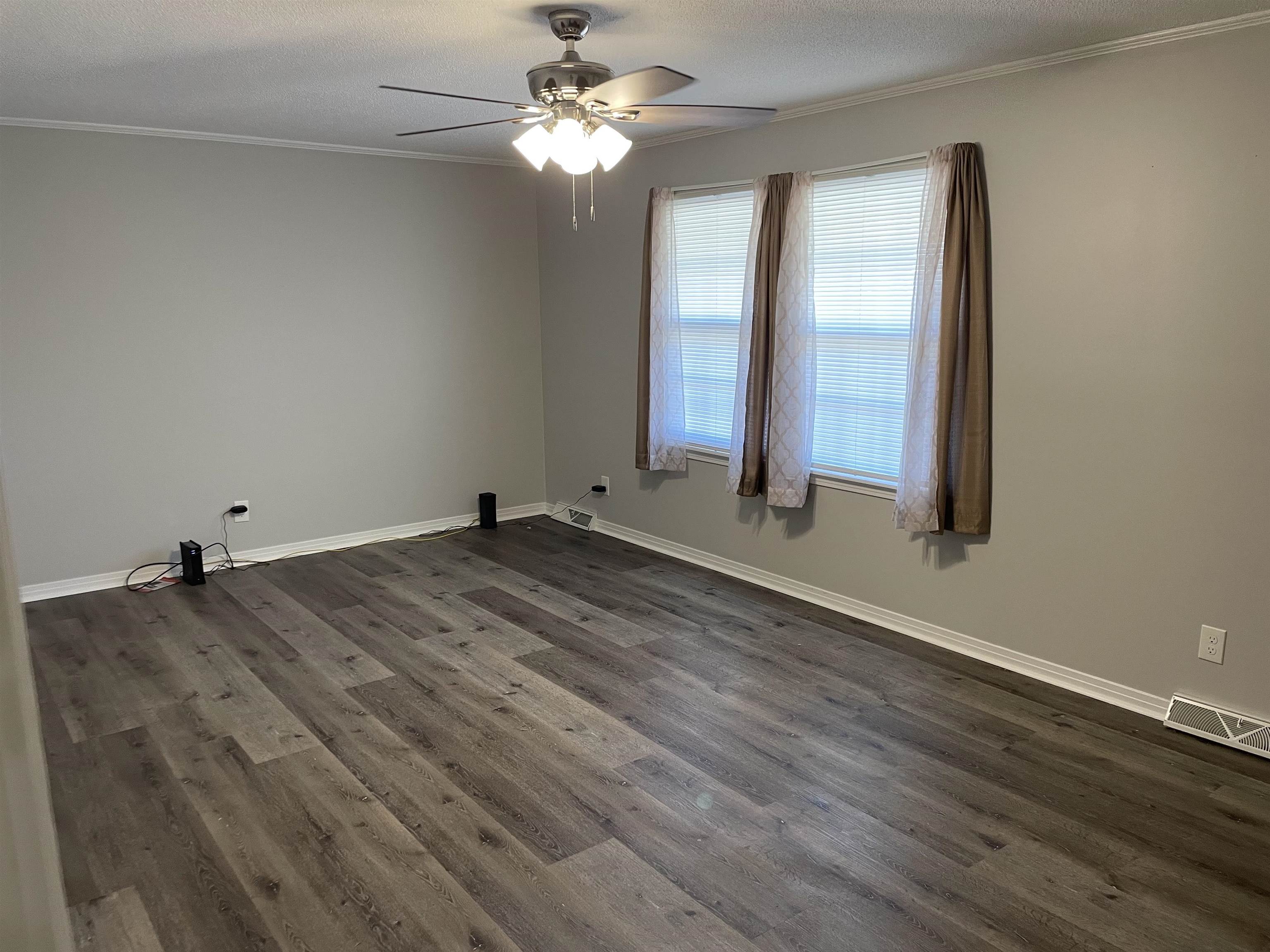 235 Paine Road Savannah, TN 38372 - Photo 11 of 28 wooden floor in an empty room with a window