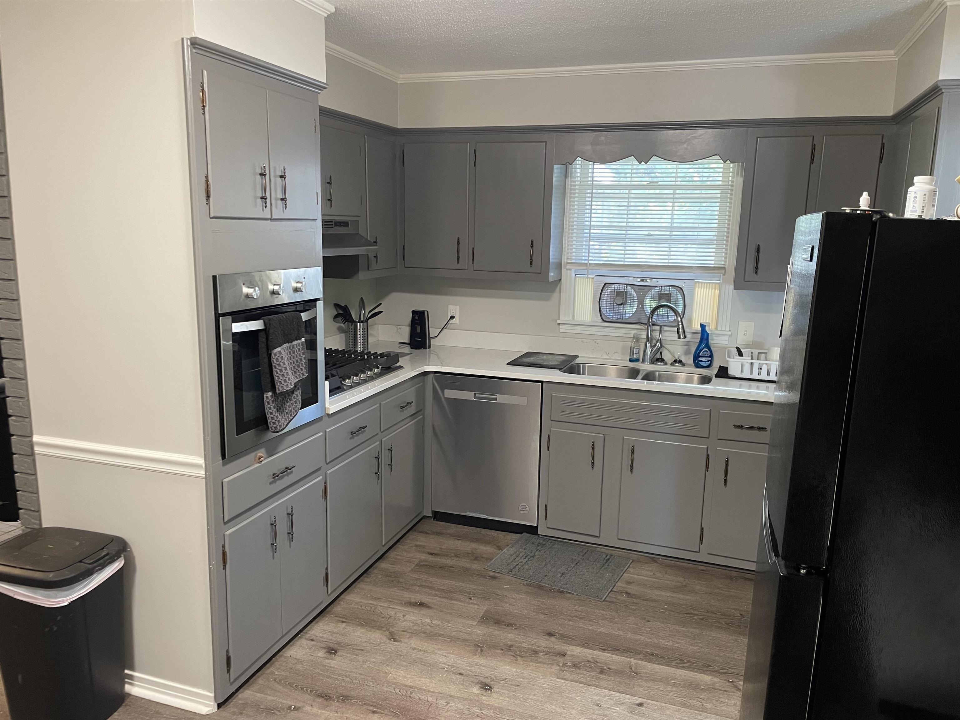 235 Paine Road Savannah, TN 38372 - Photo 2 of 28 a kitchen with a sink appliances and cabinets