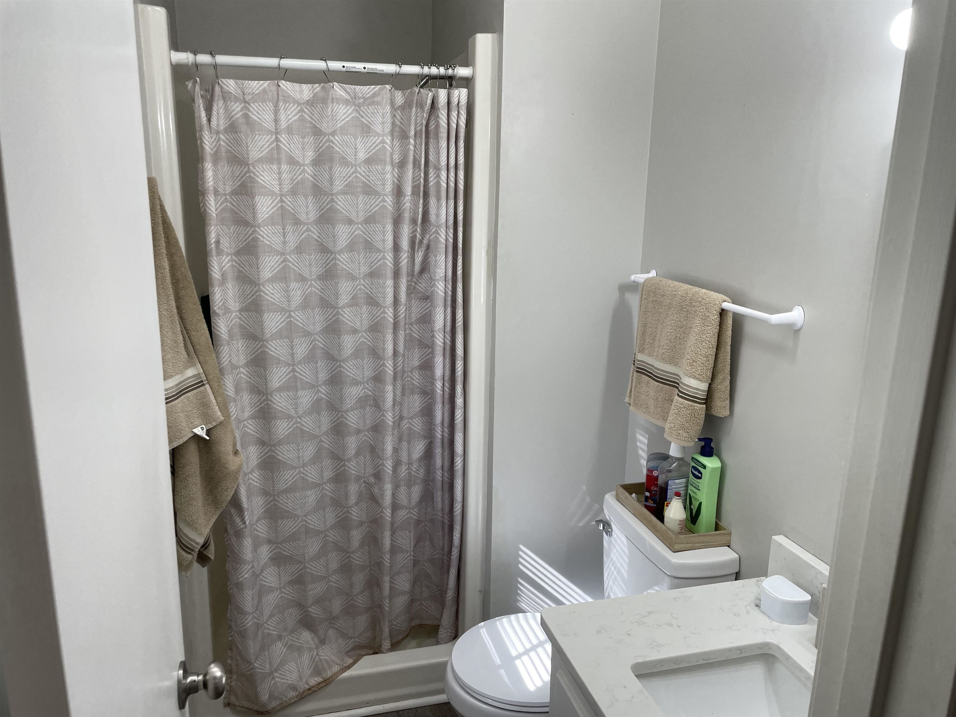 235 Paine Road Savannah, TN 38372 - Photo 21 of 28 a bathroom with a shower curtain and a toilet
