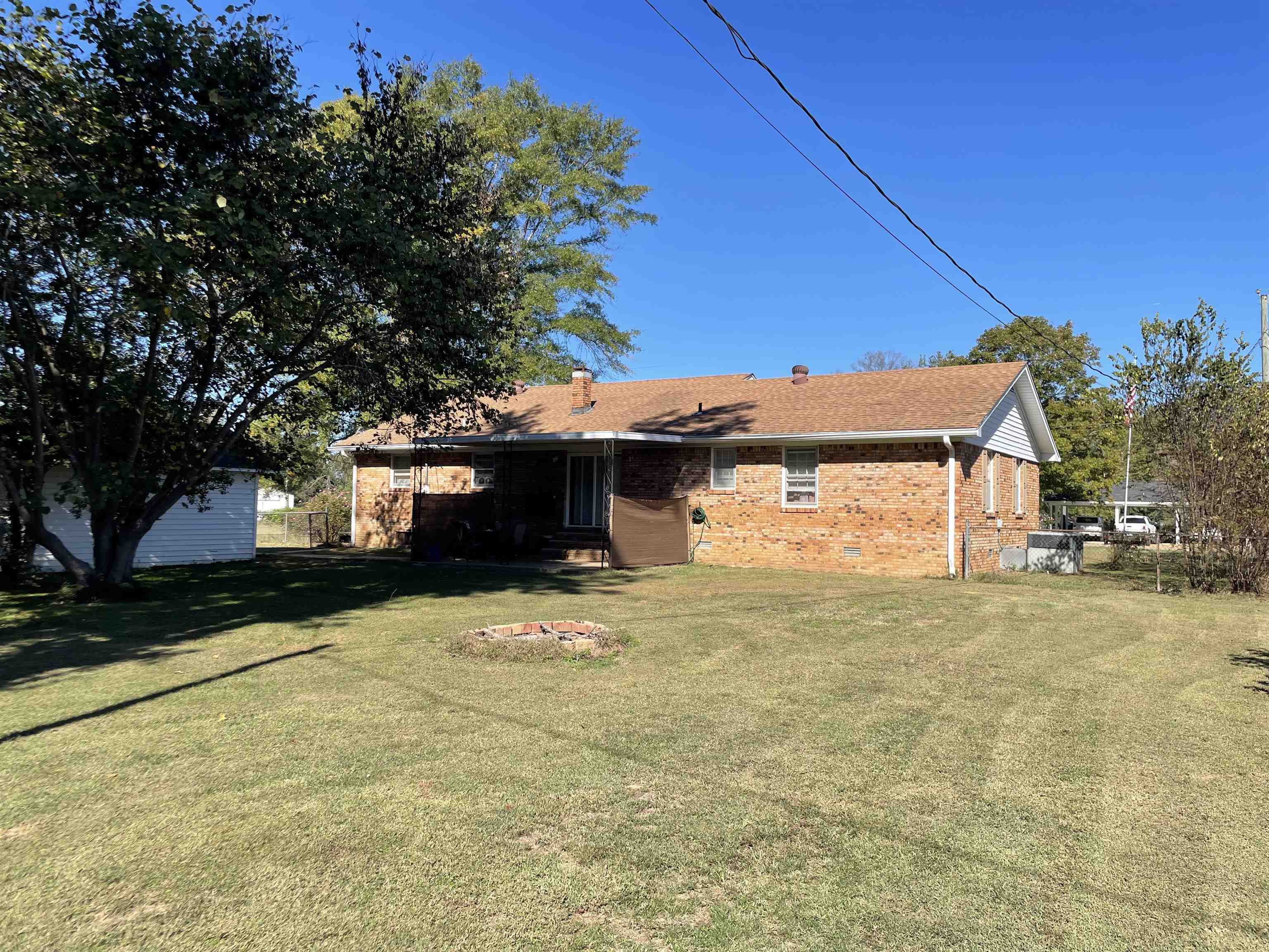 235 Paine Road Savannah, TN 38372 - Photo 22 of 28 a front view of a house with a yard