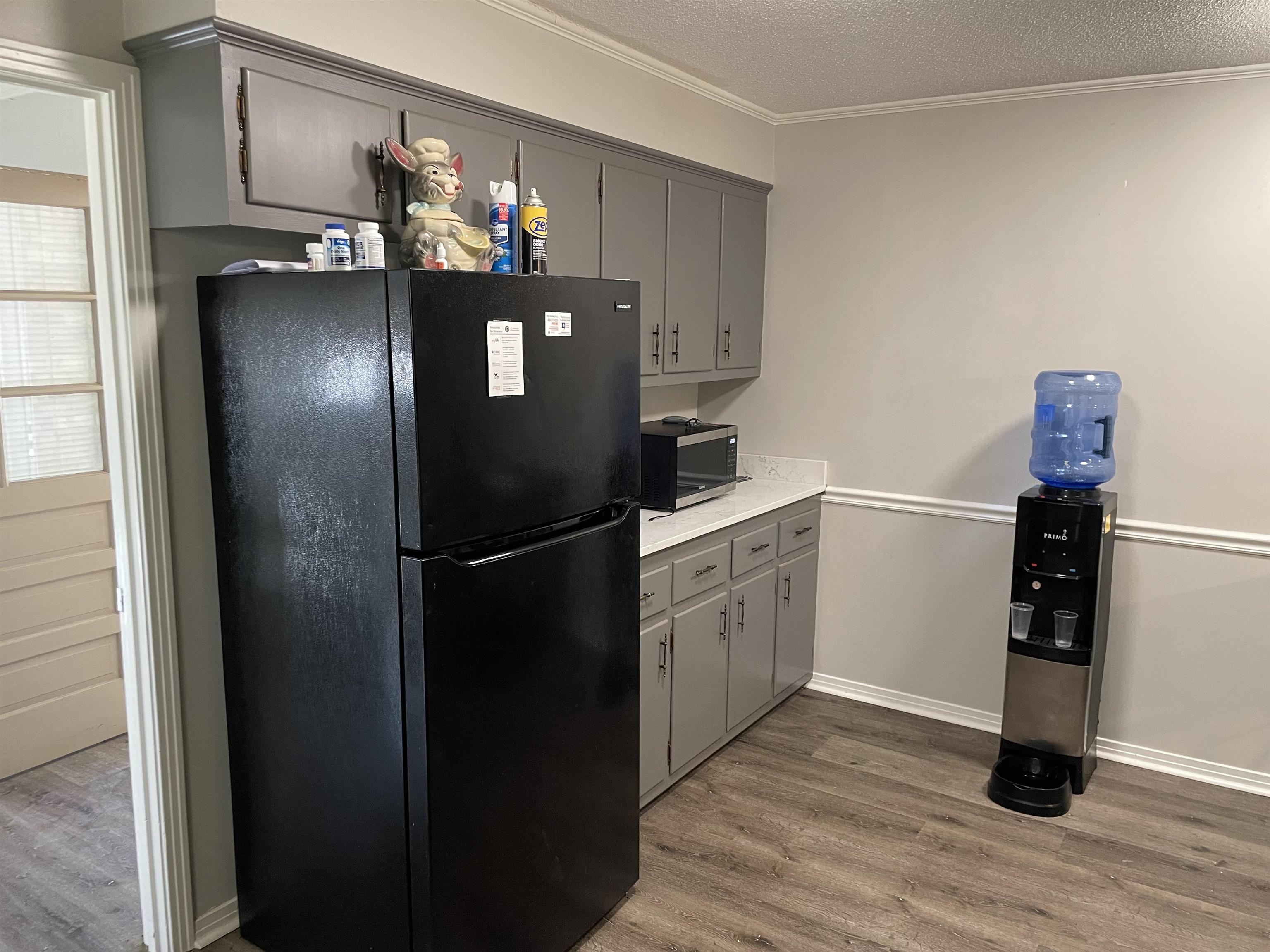 235 Paine Road Savannah, TN 38372 - Photo 4 of 28 a kitchen with refrigerator and window