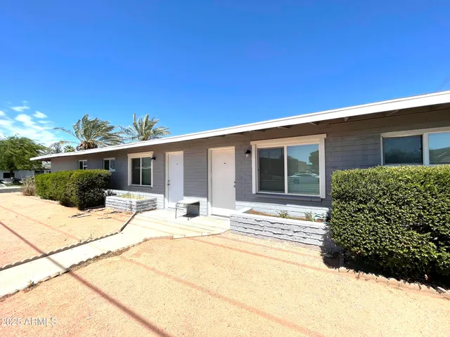 a house with trees in the background