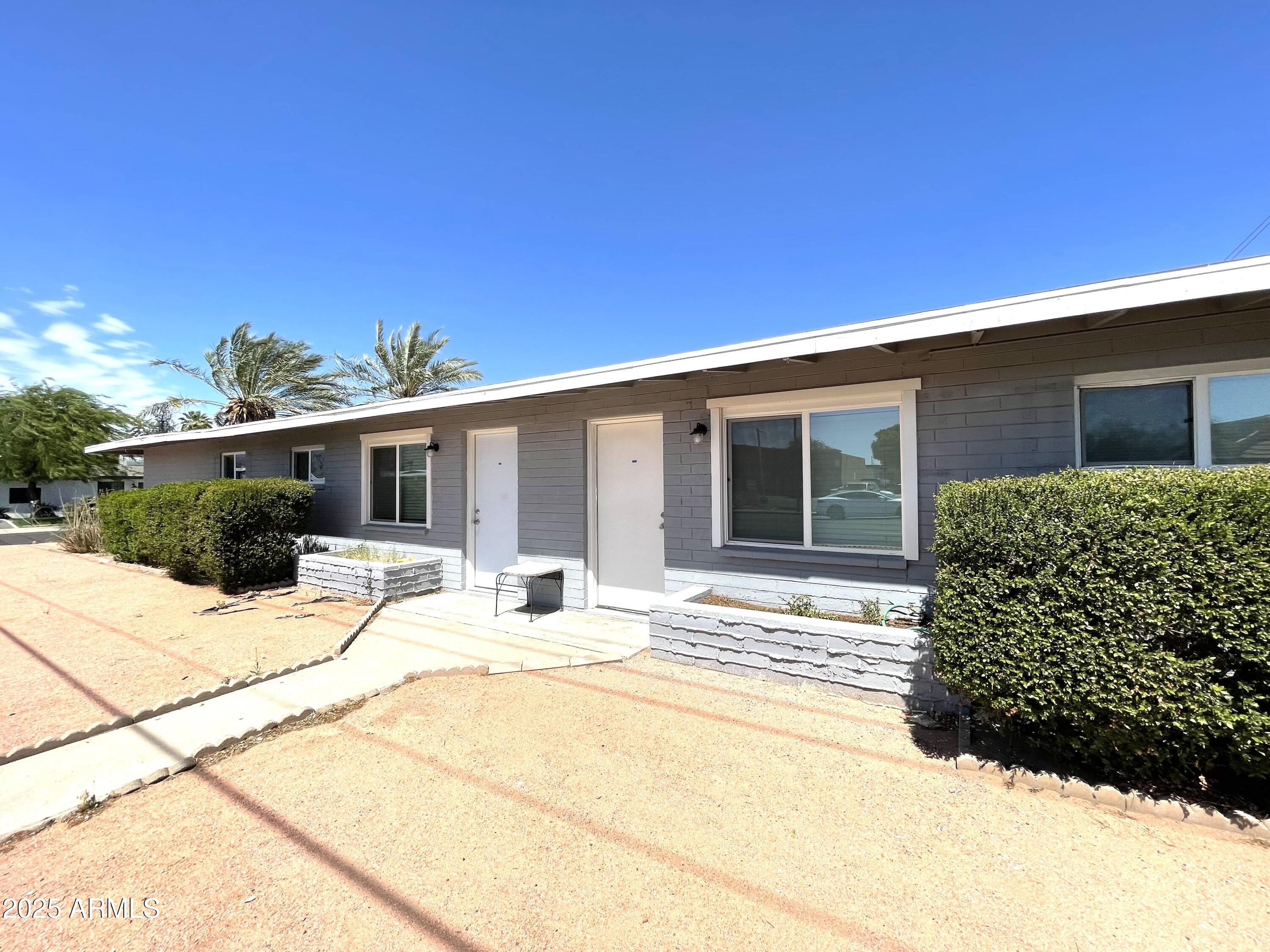 a house with trees in the background