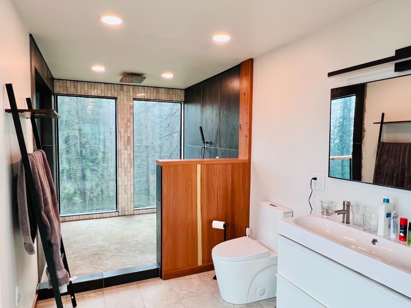 518 Container Way Boulder Creek, CA 95006 - Photo 24 of 33 a bathroom with a double vanity sink toilet and shower