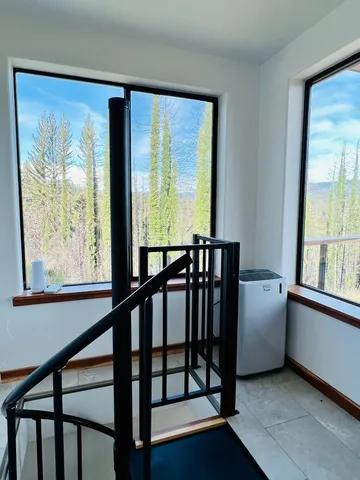 a view of swimming pool with sitting area