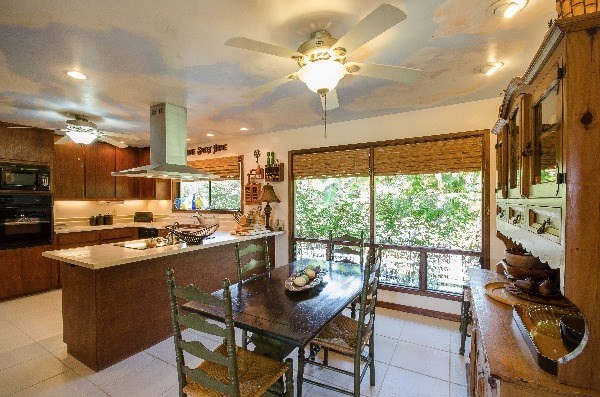 550 Akolea Road Hilo, HI 96720 - Photo 16 of 25 a kitchen with stainless steel appliances granite countertop a stove and a refrigerator