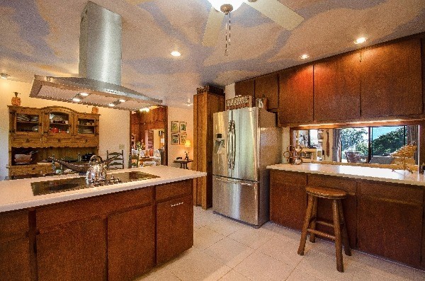 550 Akolea Road Hilo, HI 96720 - Photo 8 of 25 a kitchen with stainless steel appliances a sink stove and refrigerator