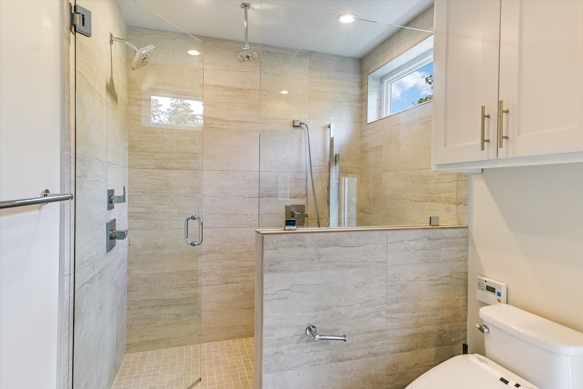 1605 Hether Street Austin, TX 78704 - Photo 17 of 26 Glass-enclosed shower with tile surround and mosaic floor