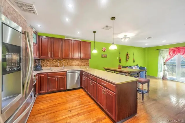 a spacious bedroom with a bed and a chandelier